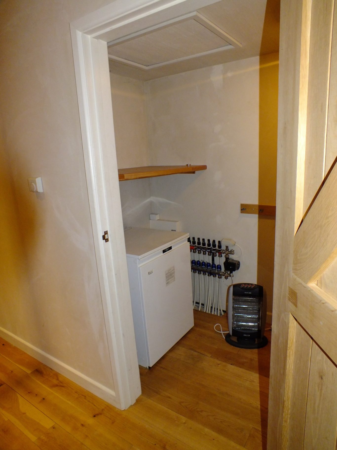 Original Boiler Small laundry room with a boiler and a shelf.
