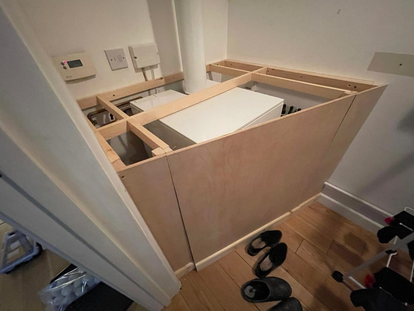 Boxing in partially built Wooden framework for the boiler cabinet, partially assembled.